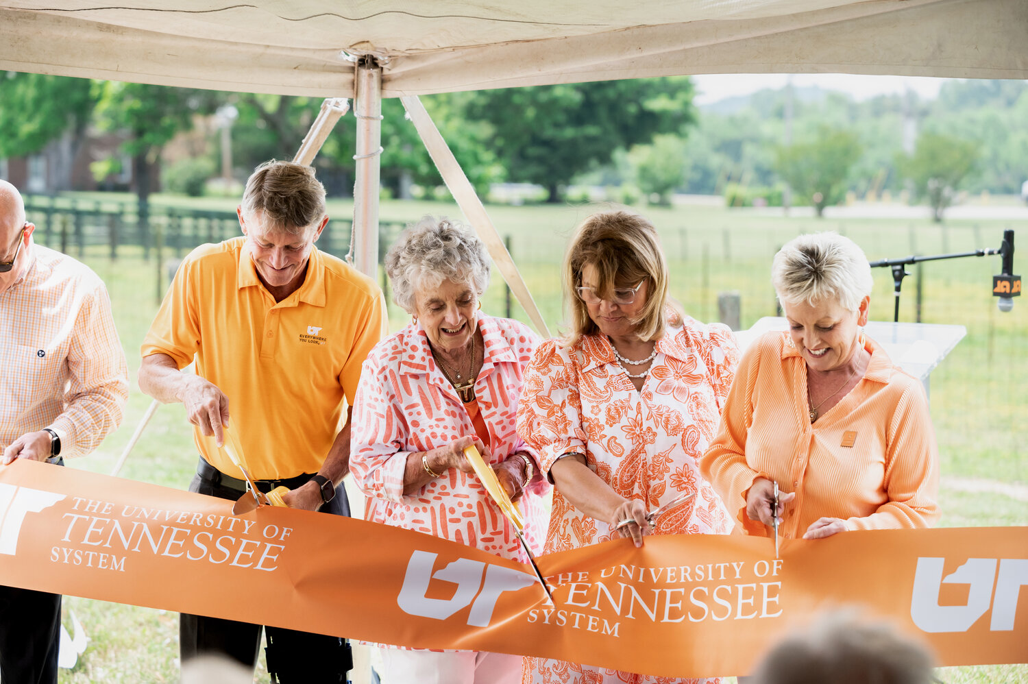 L-R: Randy Boyd, president, University of Tennessee System, Rena Johnson, Cathryn Johnson Rolfe, and Cynthea Johnson Amason cut the ribbon signifying the official dedication of the “Everywhere You Look, UT” mural on the Johnson Farm.